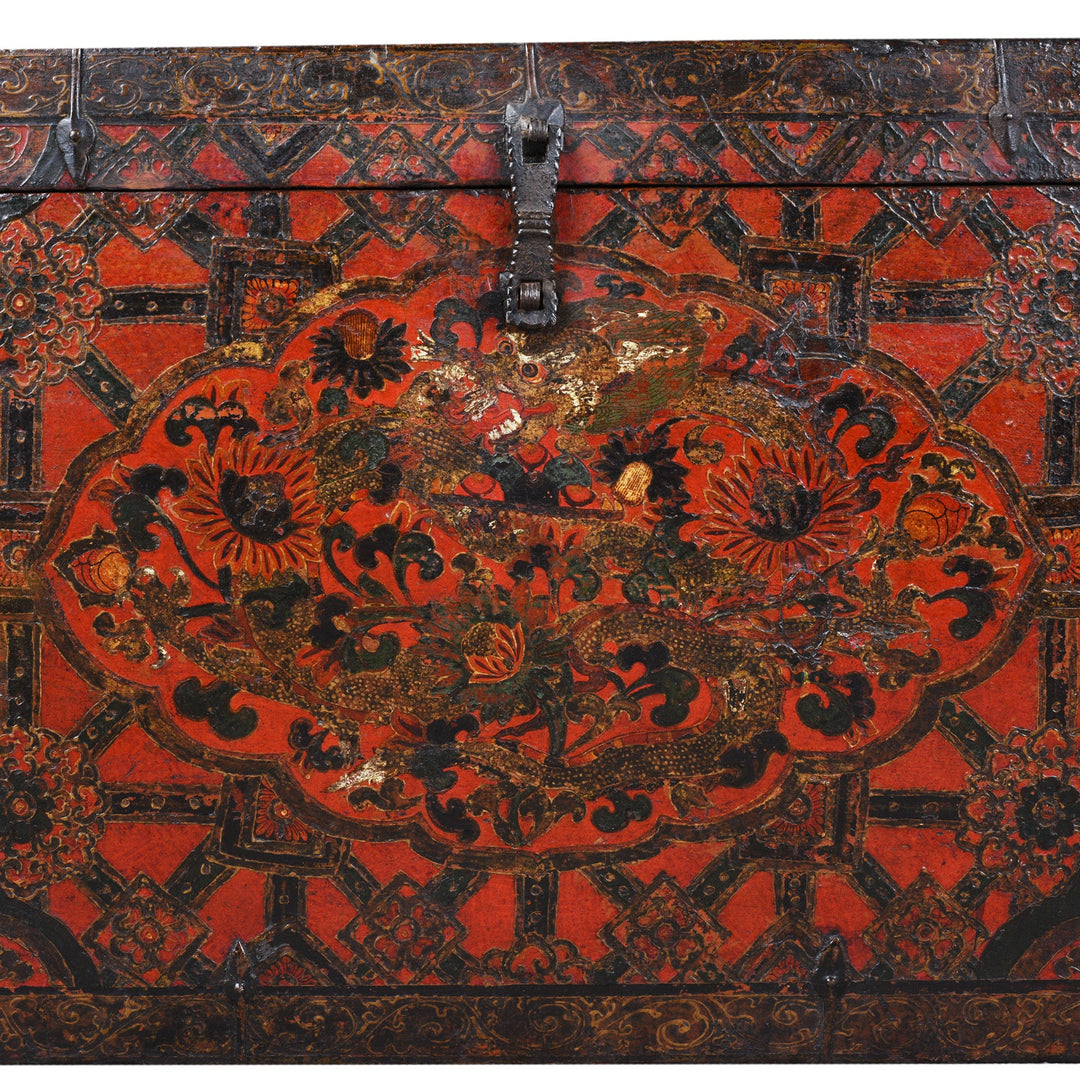 Paintwork Detail From Antique Tibetan Painted Storage Chest With Red And Gold Floral Motif And Central Dragon Design
