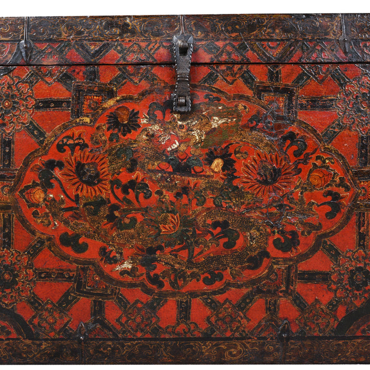 Paintwork Detail From Antique Tibetan Painted Storage Chest With Red And Gold Floral Motif And Central Dragon Design
