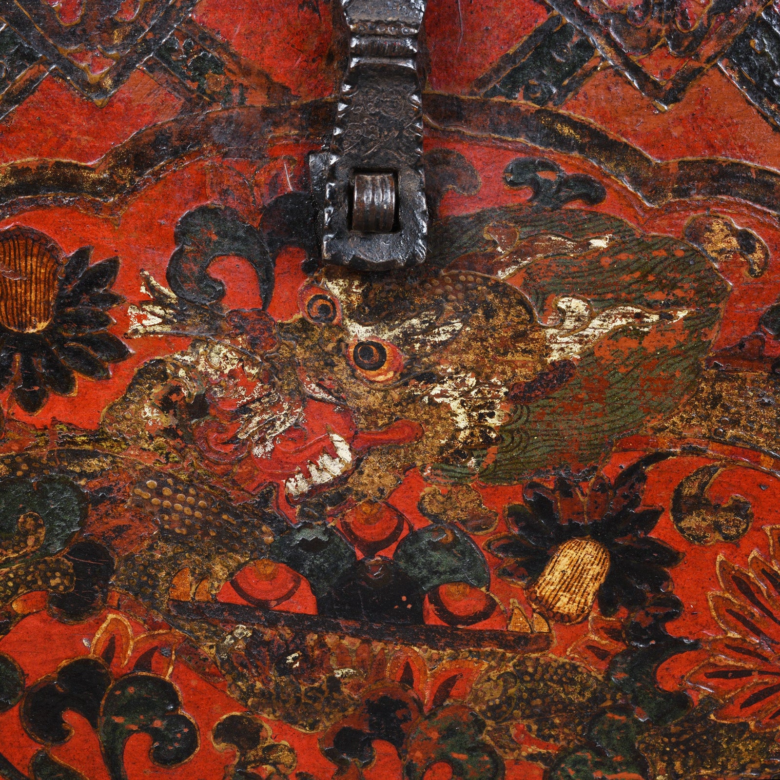 Detail View Of Dragon Paintwork From Antique Tibetan Painted Storage Chest With Red And Gold Floral Motif And Central Dragon Design