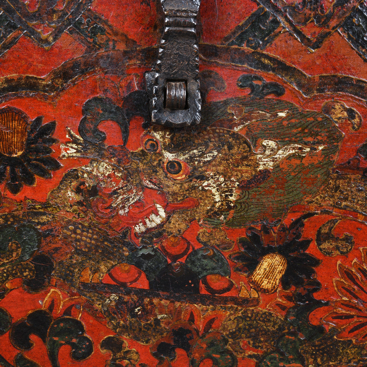 Detail View Of Dragon Paintwork From Antique Tibetan Painted Storage Chest With Red And Gold Floral Motif And Central Dragon Design