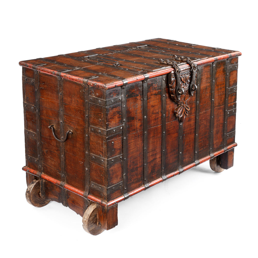 Angled View Of Antique Indian Brass Bound Teak Chest On Wheels | Indigo Antiques
