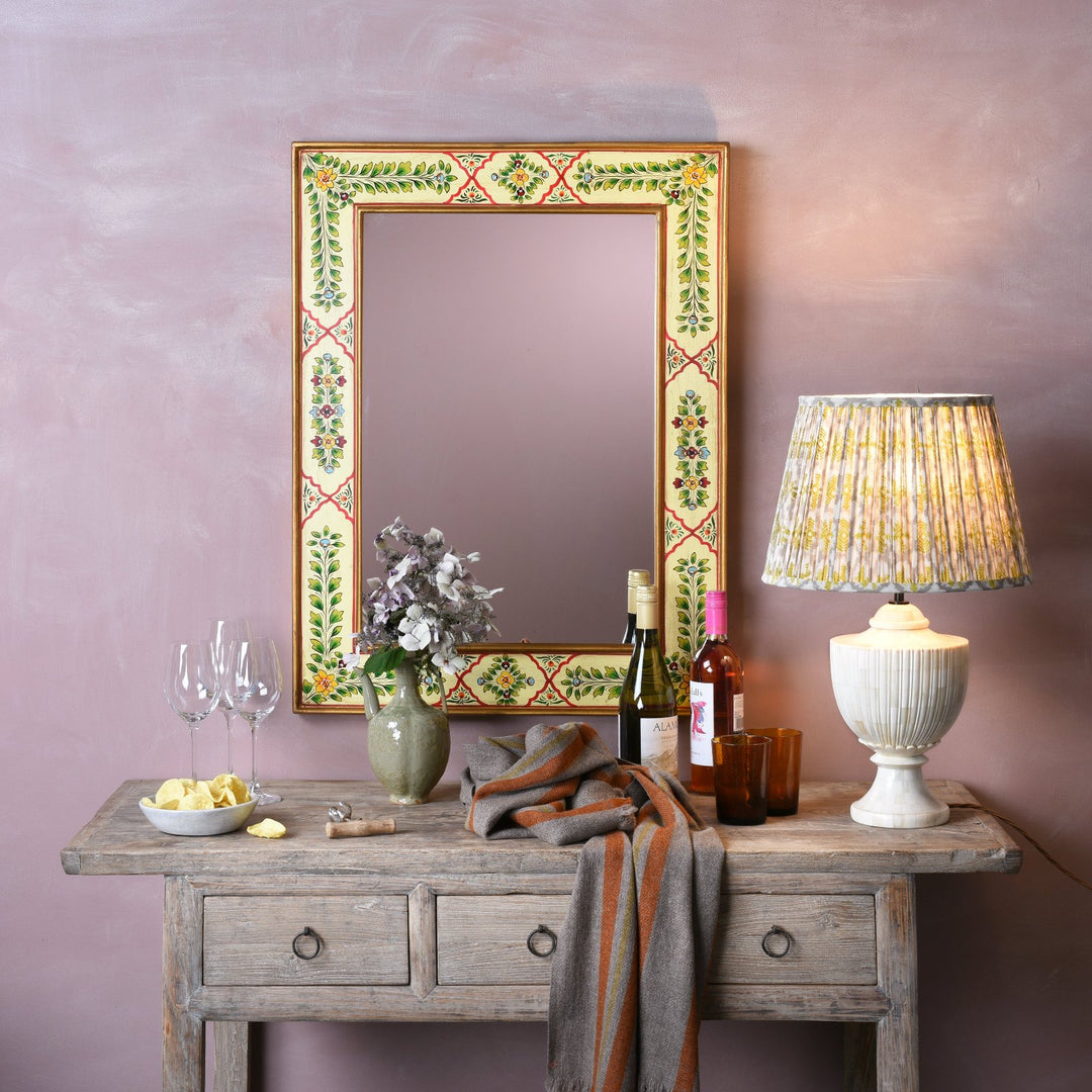 Rajasthani yellow painted mirror in a traditional English interior