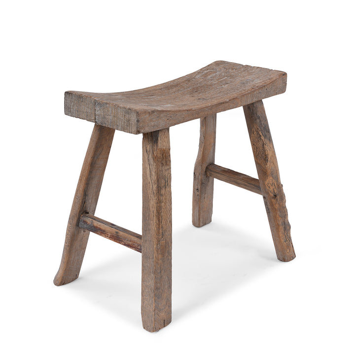 Rustic 19th Century Elm Saddle Stool With Hand Shaped Seat And Stretcher Supports Showing Natural Patina And Age Wear | Indigo Antiques