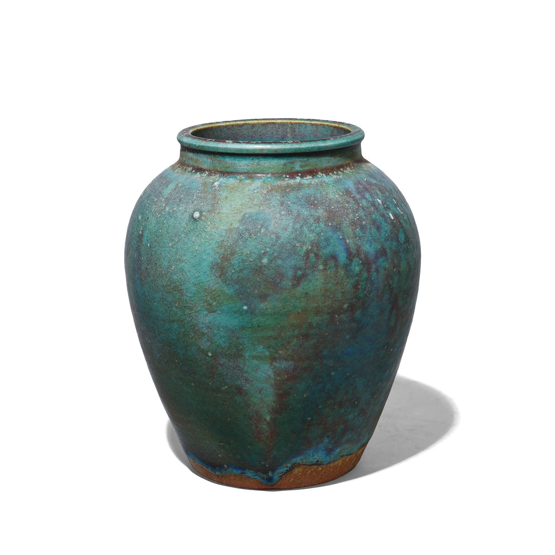 Small handmade Jingdezhen porcelain vase with green copper yaobian glaze in mottled turquoise, teal and deep blue with reddish-brown tones and a fine crackled surface.