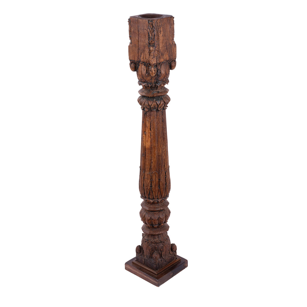 Tall 19th-century Indian carved teak architectural pillar converted into a floor-standing candlestick, with ornate floral carving, rich aged patina and metal candle dish.