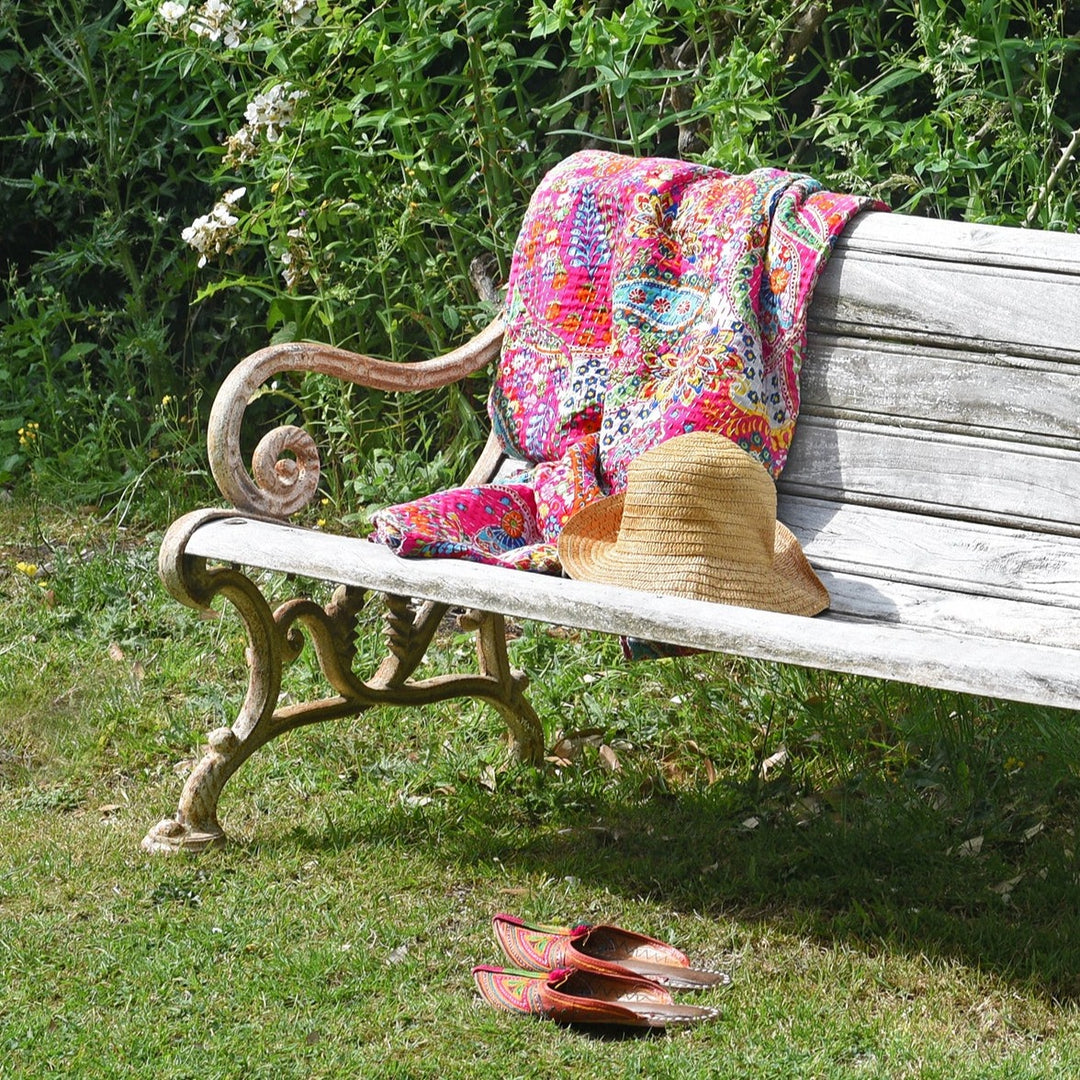 Pink Paisley Indian Kantha Throw on Bench Outdoors with Slippers