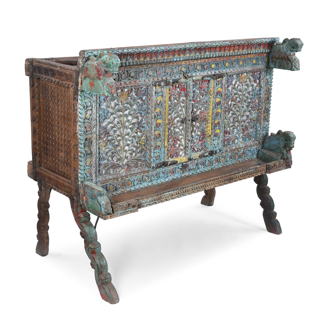 Angled View Of Antique Gujarati Majus Dowry Chest With Painted Floral Carving And Horse Head Finials
