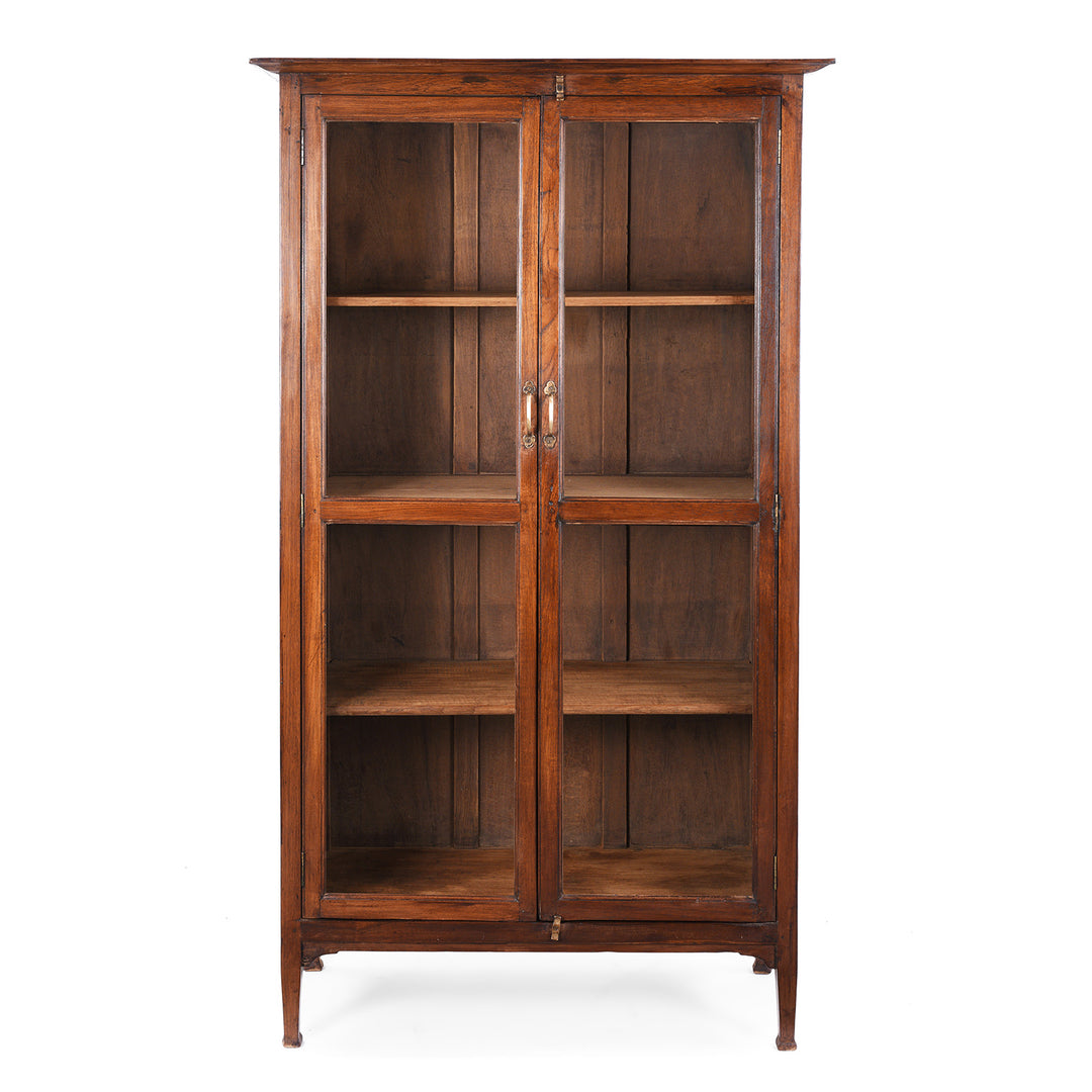 Antique Anglo-Indian teak book cabinet from Gujarat, circa 1910, with glazed doors and three interior shelves