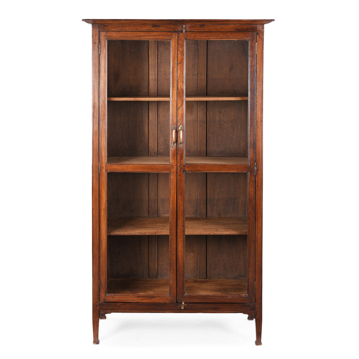 Antique Anglo-Indian teak book cabinet from Gujarat, circa 1910, with glazed doors and three interior shelves