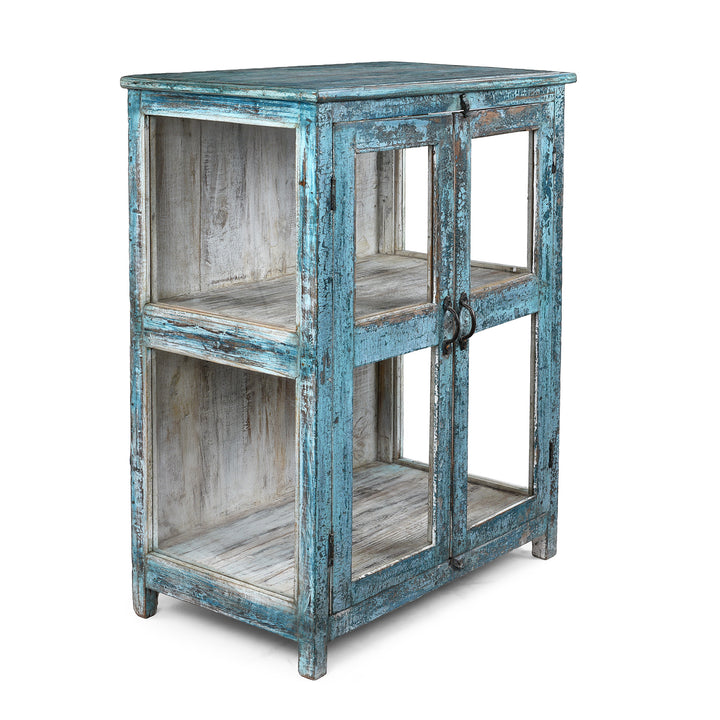 Angled VIew Of Elegant Glazed Display Cabinet From 19th Century Gujarat With Distressed Blue Exterior And White Interior, Featuring Shelf For Generous Storage