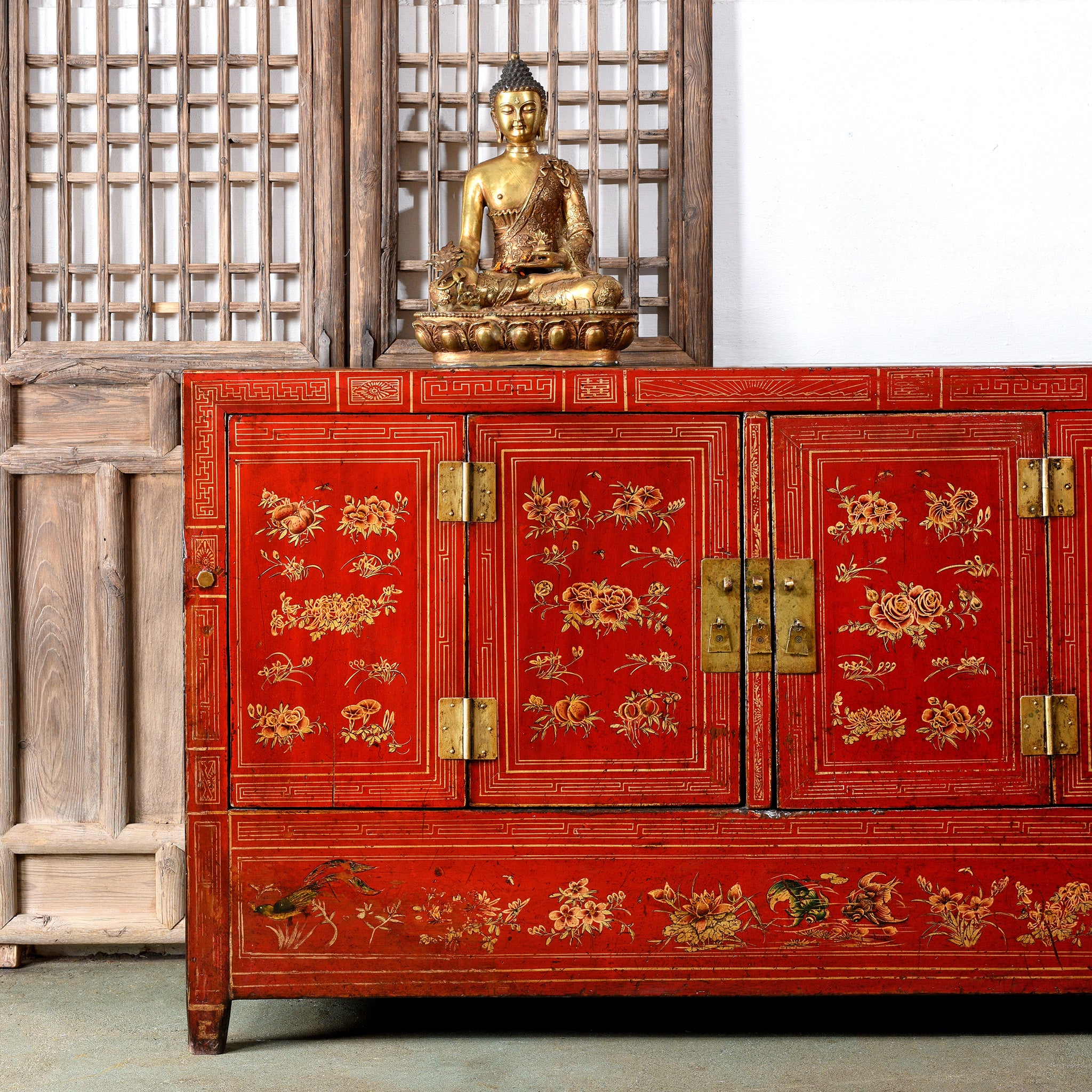 Antique Chinese red sideboard with gold statue