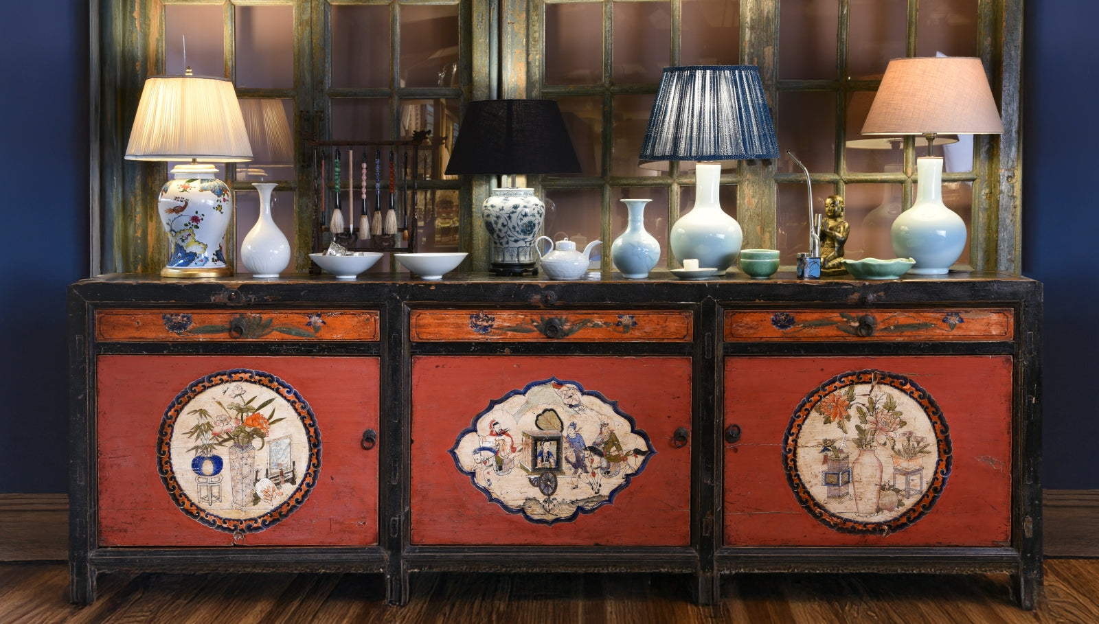 Mongolian painted sideboard with porcelain lamps and Chinese porcelain on