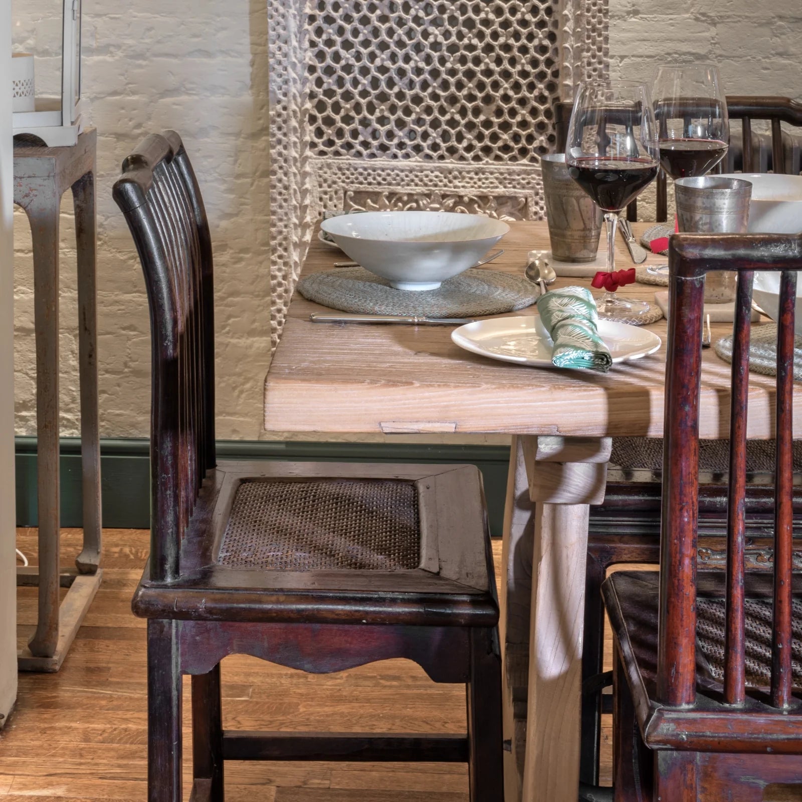 Antique chairs alongside a modern style table