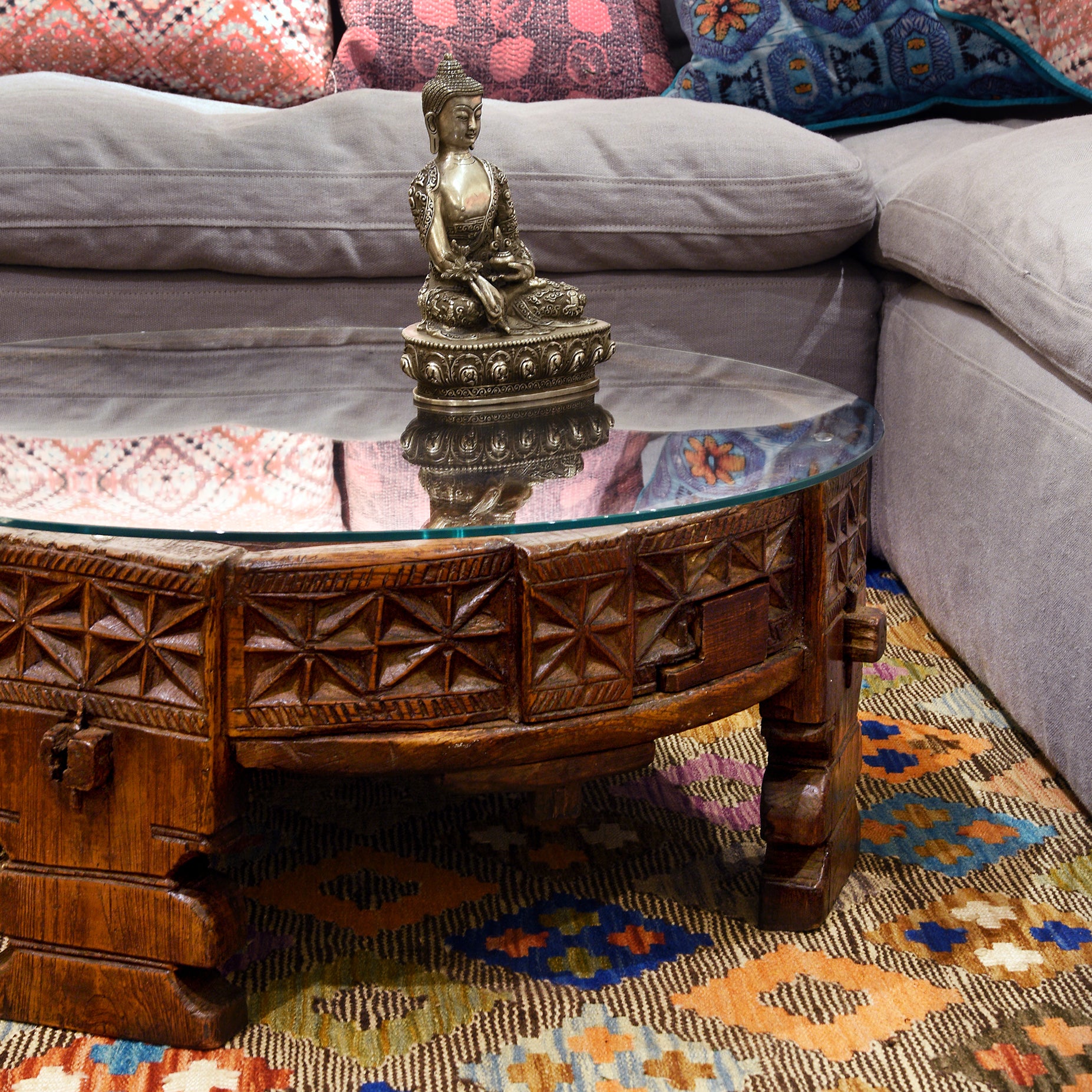 An Indian coffee table with statue