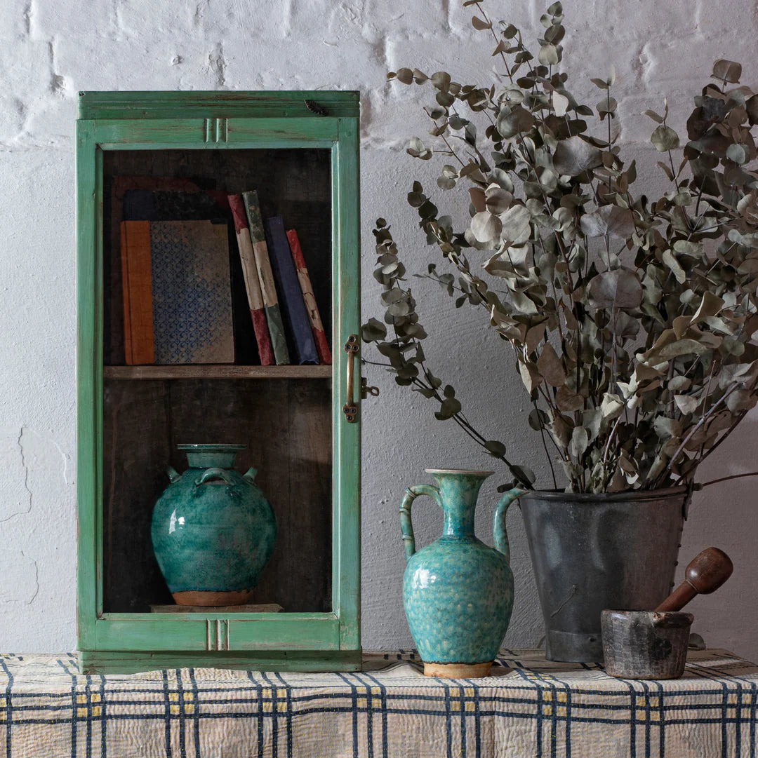 Green cabinet and vases
