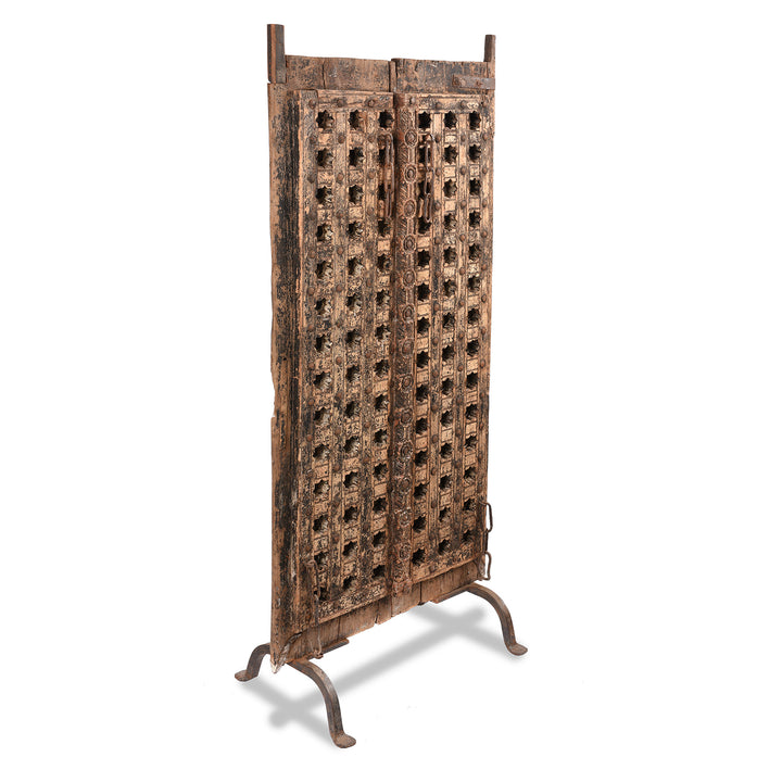 Angled View Of Antique Mughal Style Carved Indian Door - 18thC | INDIGO ANTIQUES