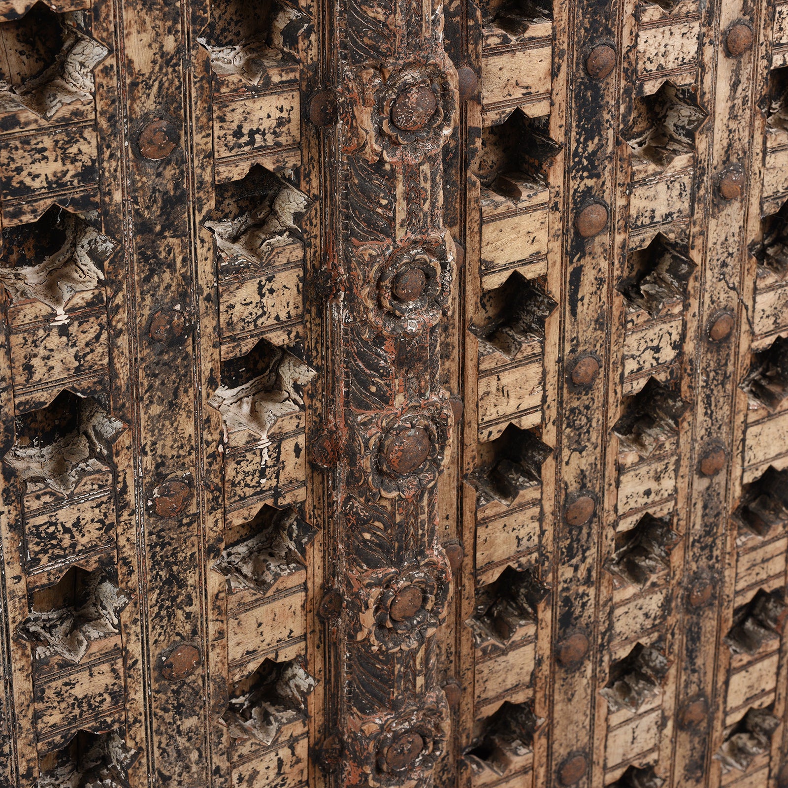 Angled View Of Antique Mughal Style Carved Indian Door - 18thC | INDIGO ANTIQUES