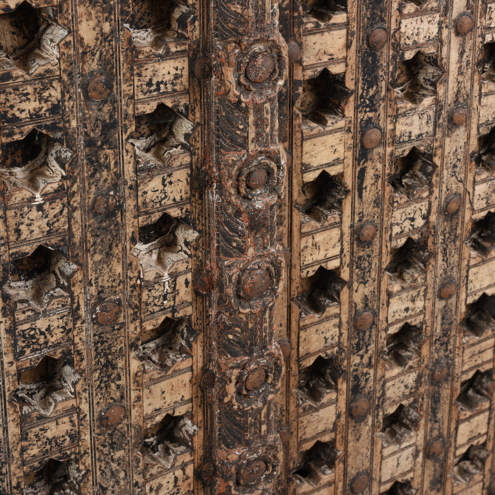 Angled View Of Antique Mughal Style Carved Indian Door - 18thC | INDIGO ANTIQUES