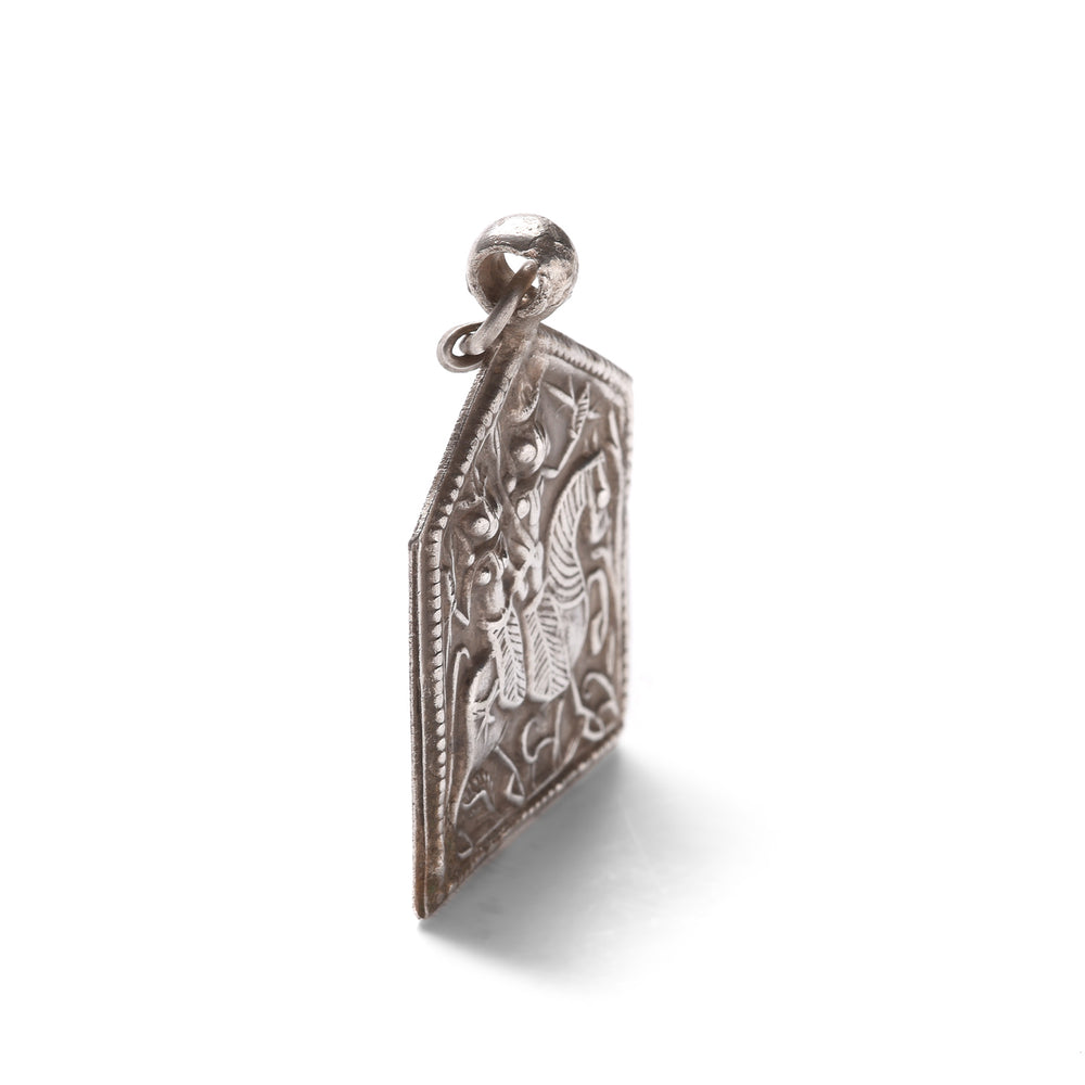 Angled View Of Antique Tribal Silver Bhumiya Raj Amulet - 19th Century | Indigo Antiques