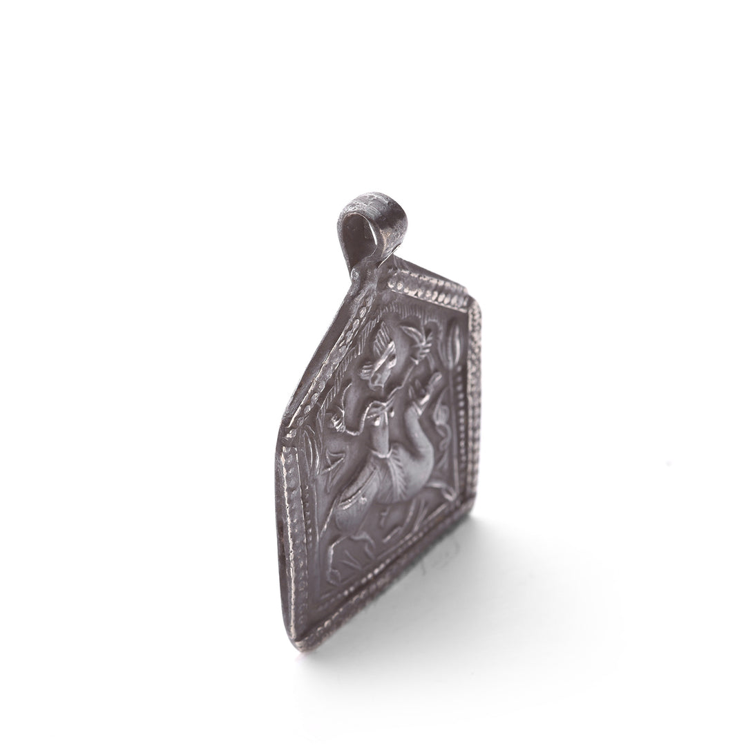 Angled VIew Of Tribal Silver Bhumiya Raj Amulet - 19thC | Indigo Antiques