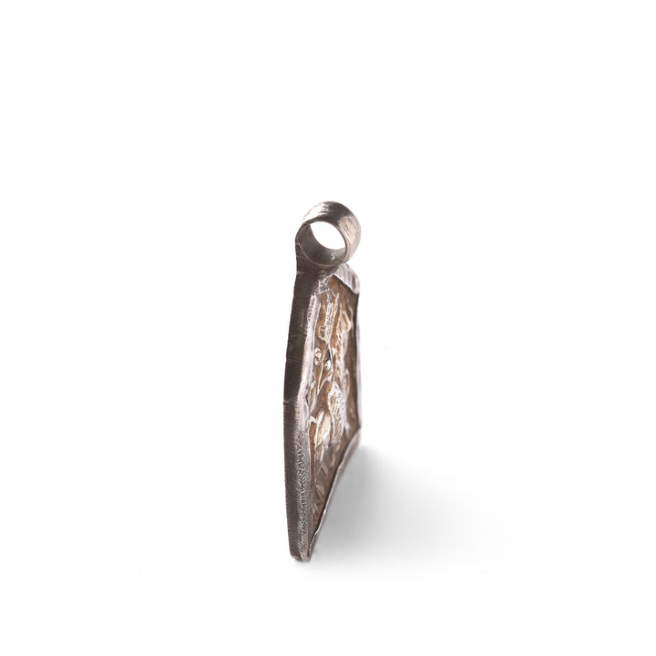 Angled VIew Of Tribal Silver & Gold Bhumiya Raj Amulet - 19thC | Indigo Antiques