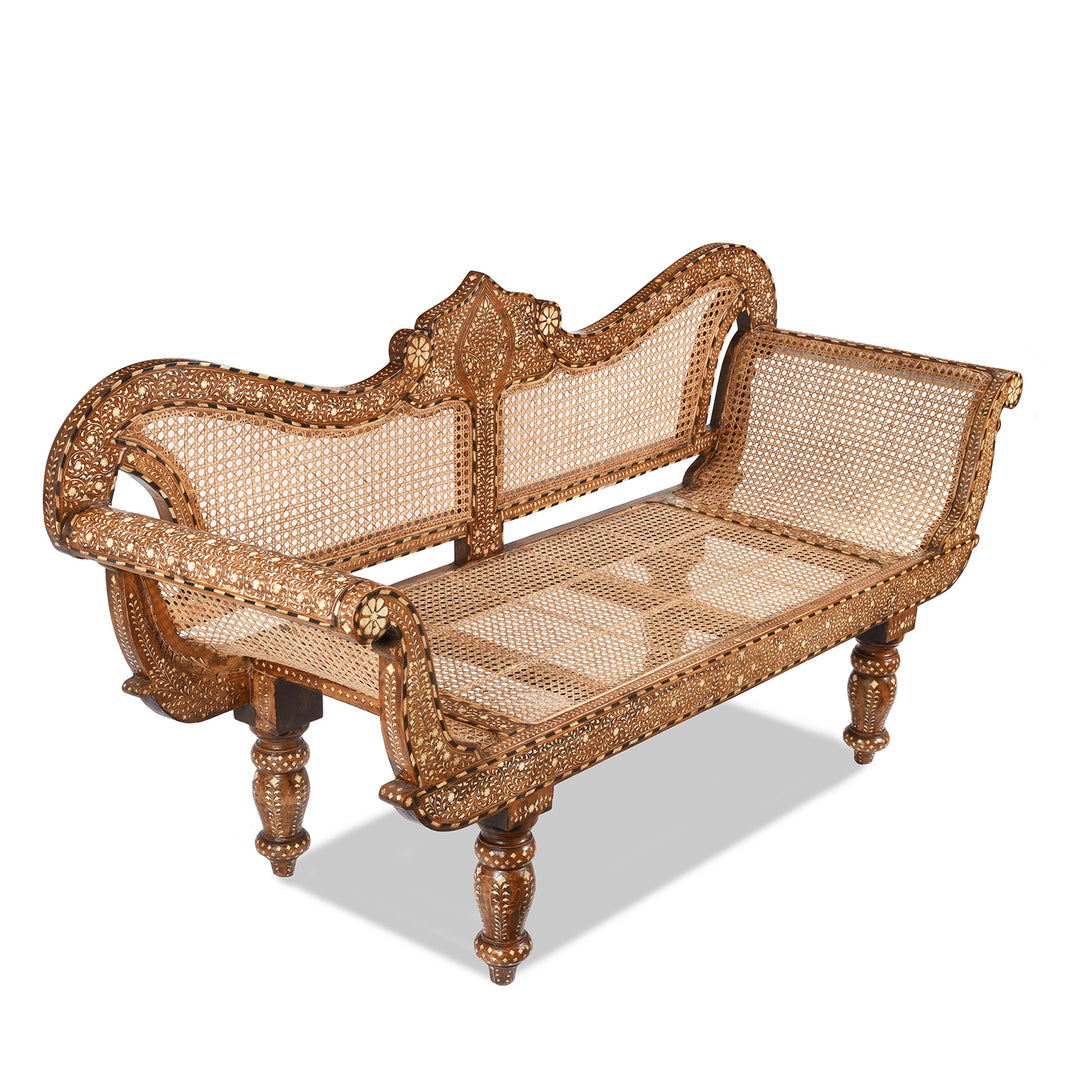 Angled View Of An Antique Anglo Indian Cane Teak Sofa - Early 20thC With Later Bone Inlay Work | Indigo Antiques