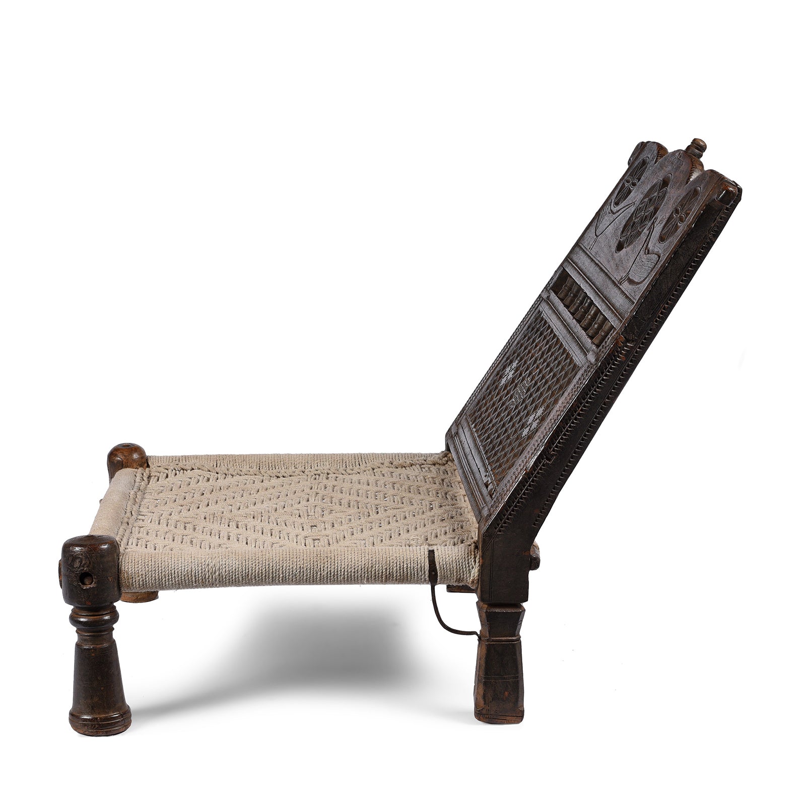 Side View Of Antique Chip Carved Low Pidha Chair From Rajasthan - 19th Century | INDIGO ANTIQUES