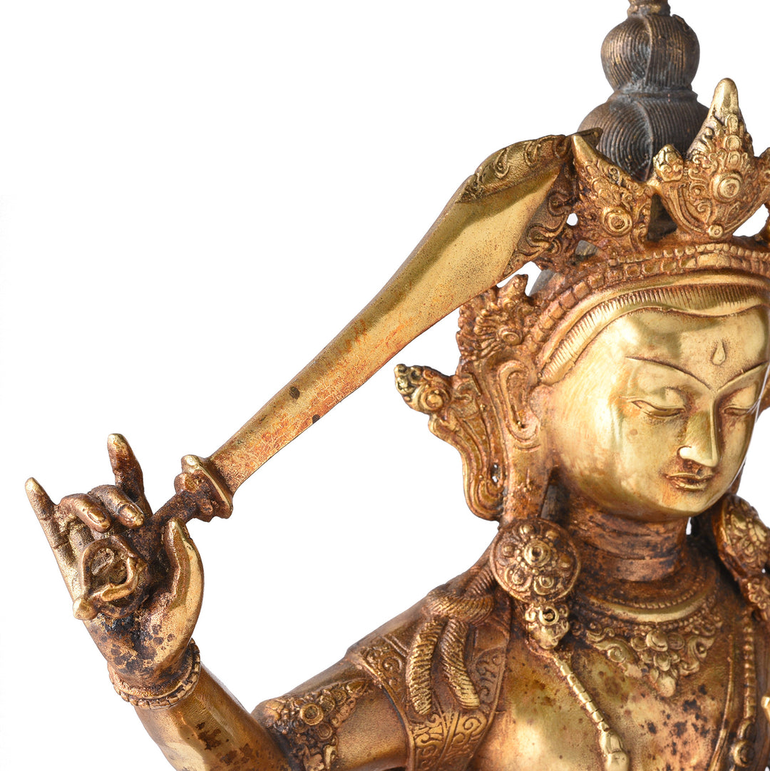 Detail From Gilded Brass Statue Of Tibetan Manjushri With his Sword Held High On a Lotus Throne| Indigo Antiques