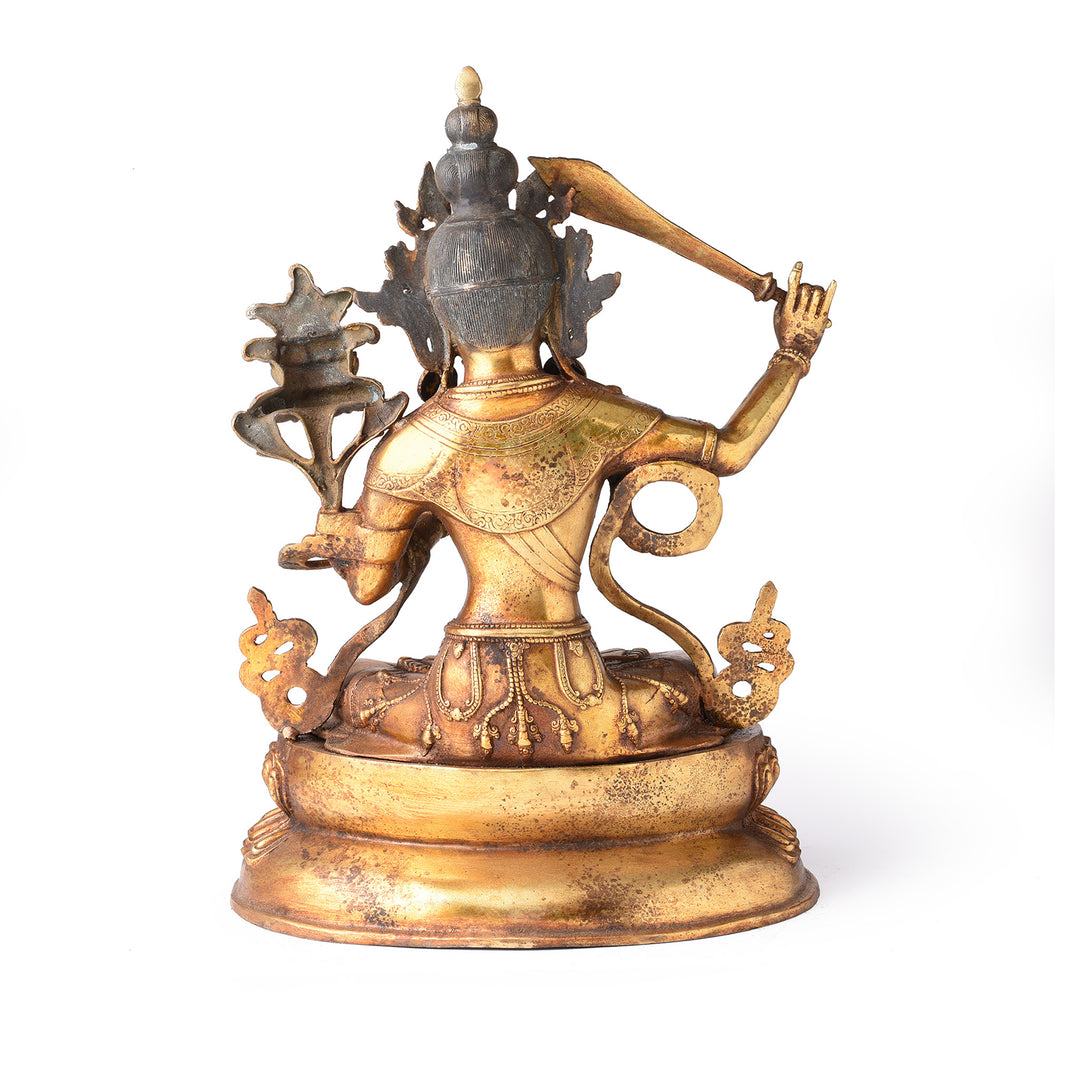 Reverse Of Gilded Brass Statue Of Tibetan Manjushri With his Sword Held High On a Lotus Throne| Indigo Antiques