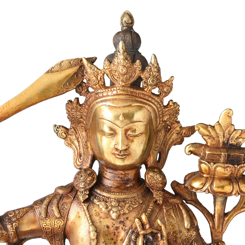 Face Detail From Gilded Brass Statue Of Tibetan Manjushri With his Sword Held High On a Lotus Throne| Indigo Antiques