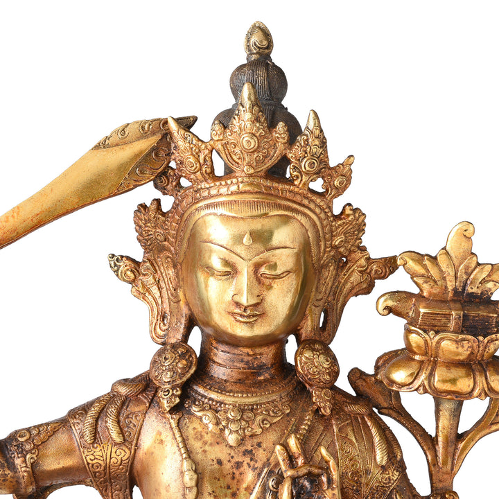 Face Detail From Gilded Brass Statue Of Tibetan Manjushri With his Sword Held High On a Lotus Throne| Indigo Antiques