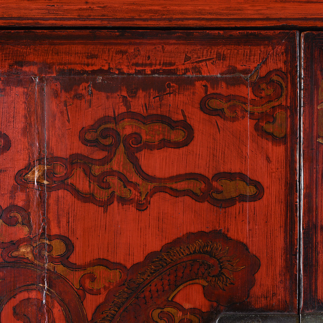 Cloud detail of an Antique Gilt Chinese Red Lacquer Chilong Dragon Wedding Cabinet | Indigo Antiques