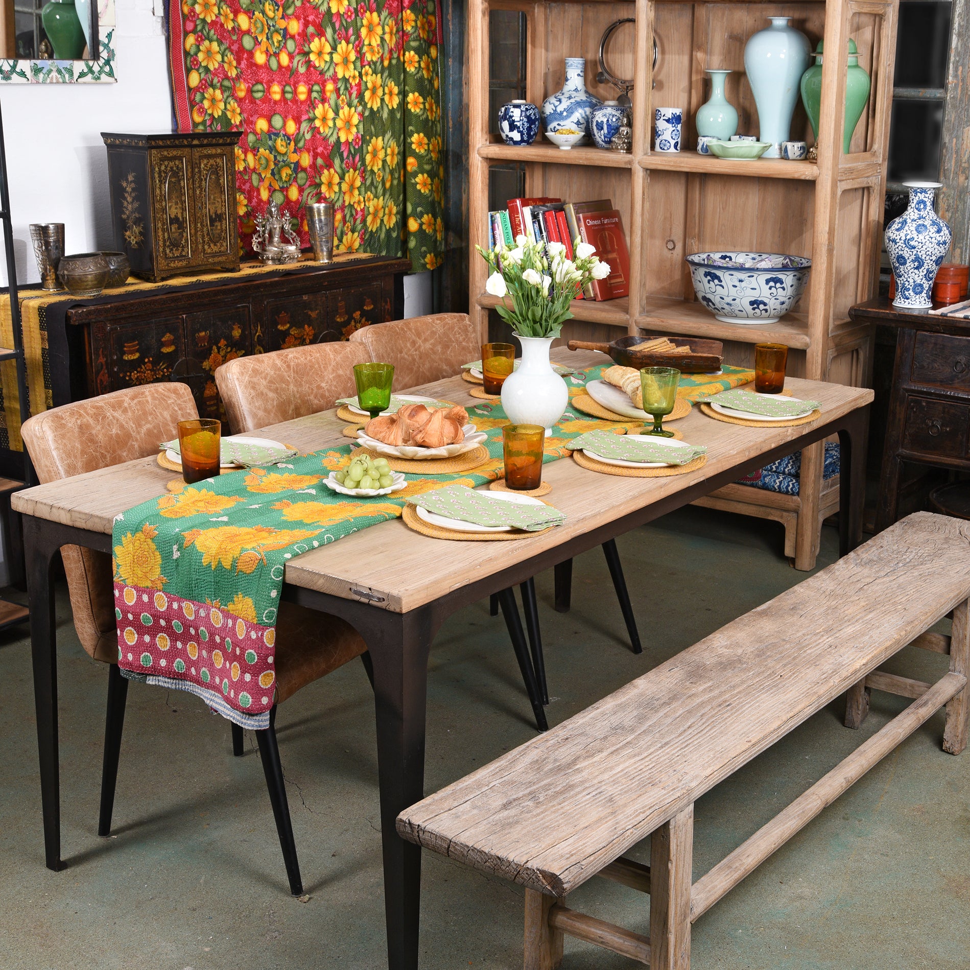 Contemporary Reclaimed Elm Dining table With Metal Legs in a dining room
