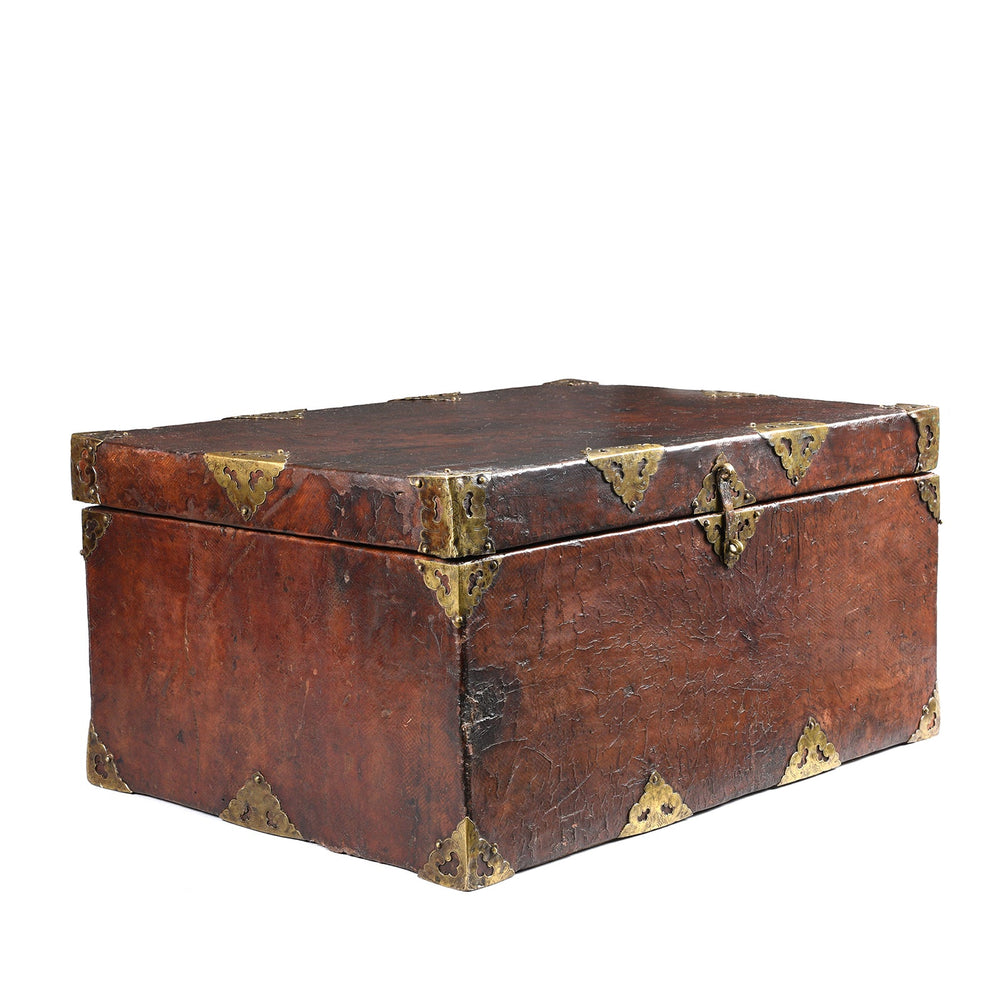 Angled View Of Tibetan Brass Bound Leather Trunk - 19thC | Indigo Antiques