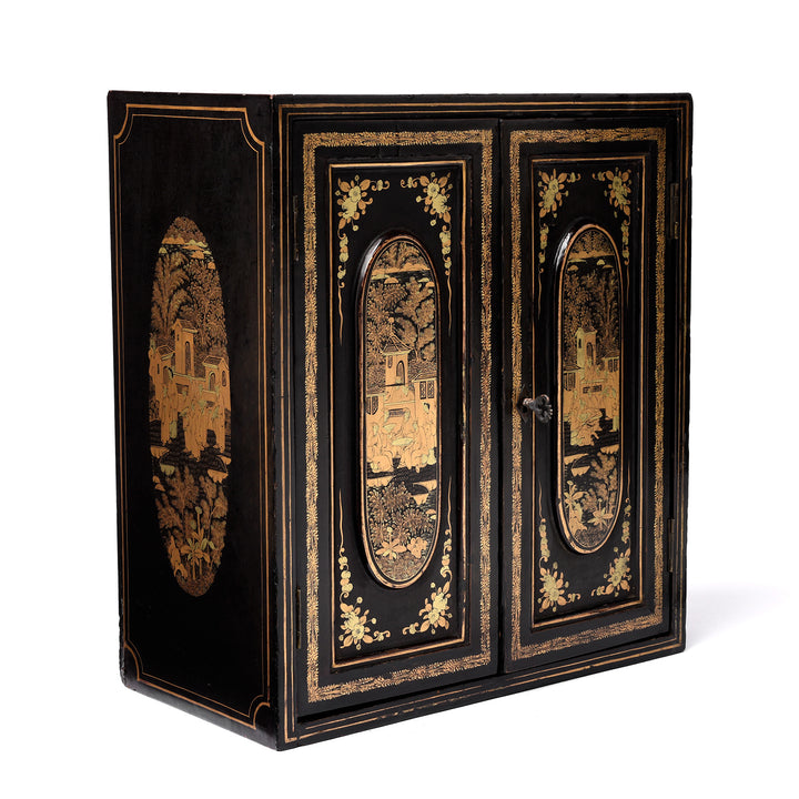 Angled View Of Antique Gilt Black Lacquer Chinoiserie Export Jewellery Cabinet - 18th Century | Indigo Antiques