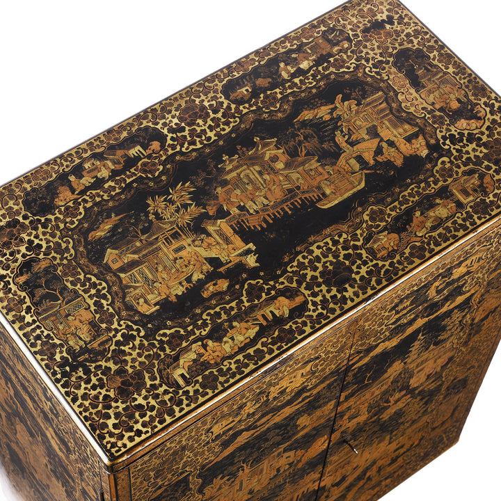 Top detail from a Gilt black lacquer Chinese export chinoiserie table cabinet. Antique & made in Canton. Similar to examples found in the Peabody Essex Museum. Exceptional quality | Indigo Antiques