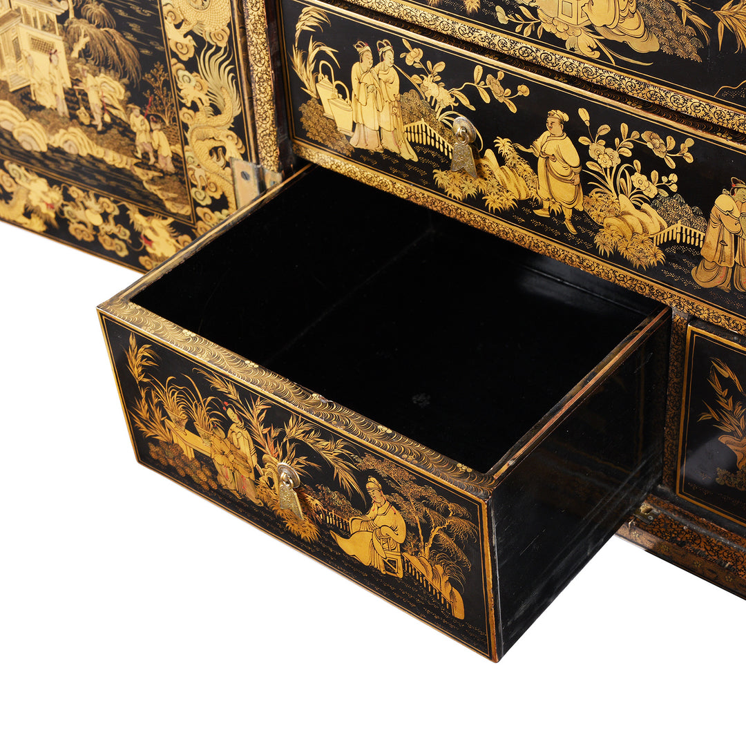 Drawer and top of drawer detail from a Gilt black lacquer Chinese export chinoiserie table cabinet. Antique & made in Canton. Similar to examples found in the Peabody Essex Museum. Exceptional quality | Indigo Antiques