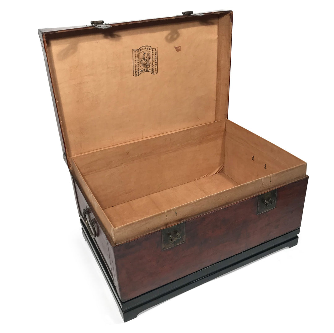 An antique Chinese leather chest from Shanxi with the lid open