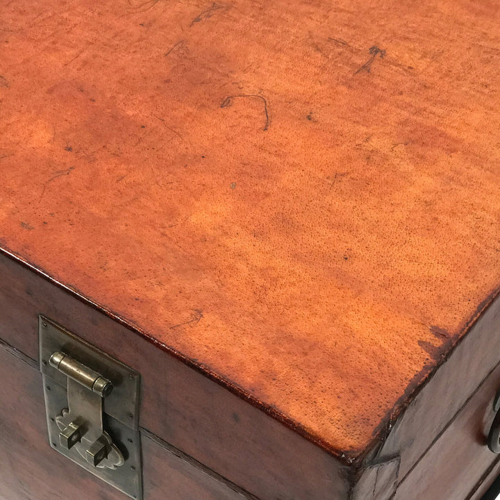Corner view of an antique leather Chinese trunk from Shanxi province dating from the 19th century.