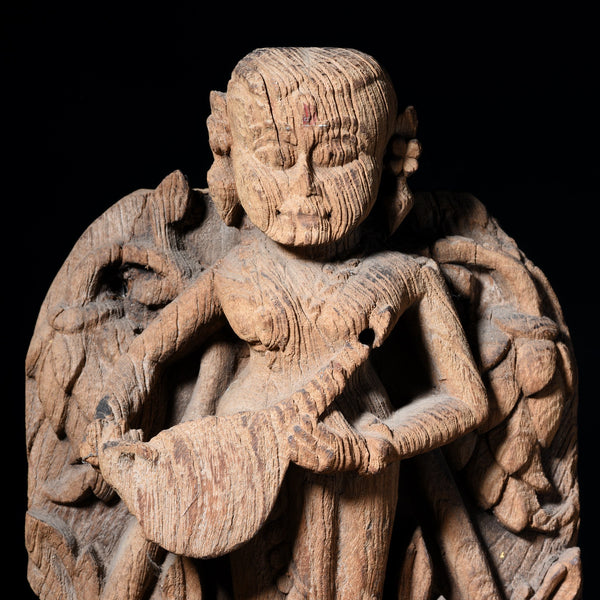 Teakwood Carving of a Musician From Gujarat - 18thC