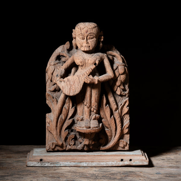 Teakwood Carving of a Musician From Gujarat - 18thC
