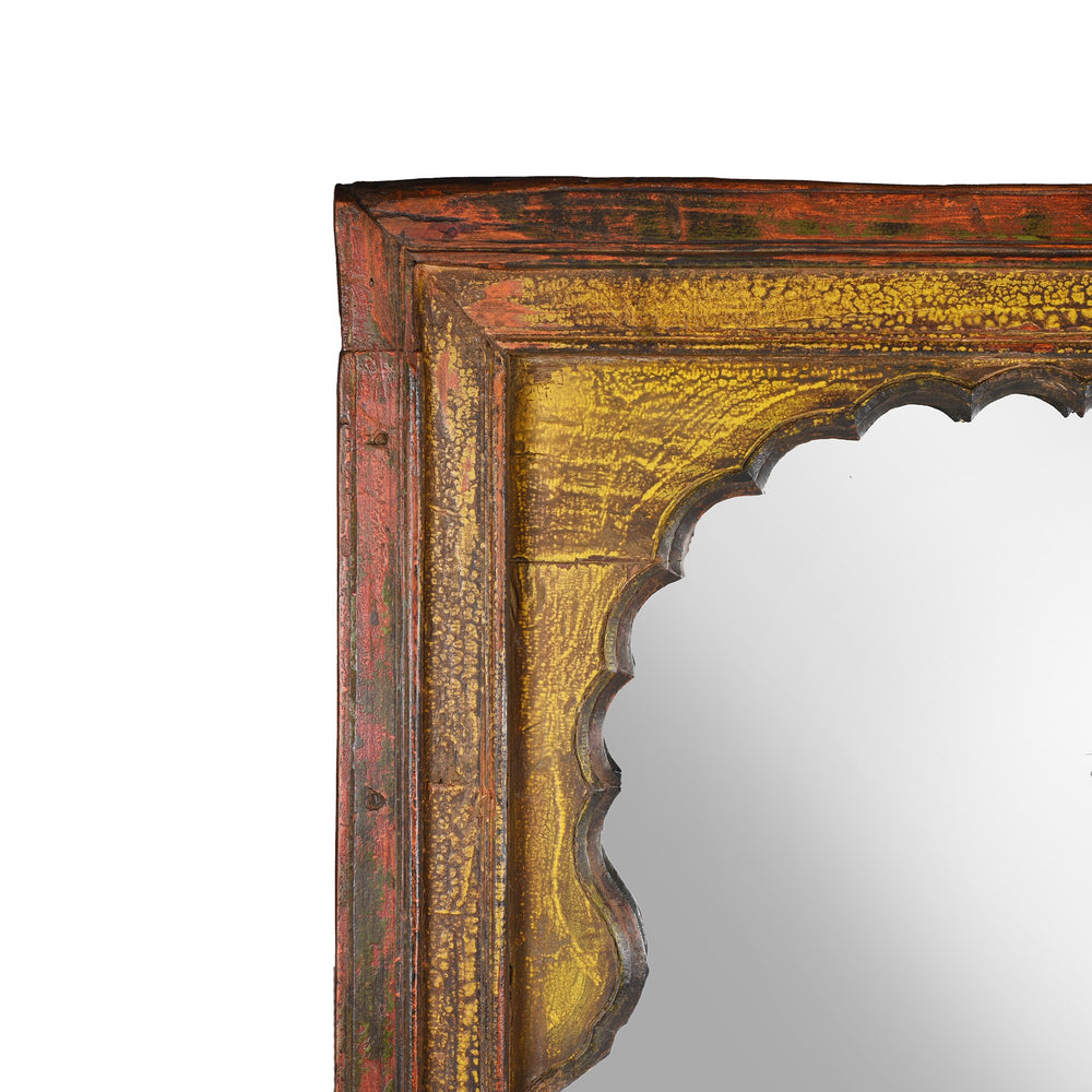 Red, yellow & green painted Indian mirror made from a vintage reclaimed mihrab window frame from Rajasthan dating from 19th century