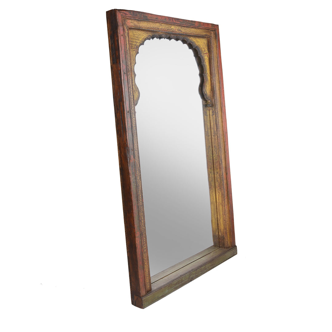 Red, yellow & green painted Indian mirror made from a vintage reclaimed mihrab window frame from Rajasthan dating from 19th century