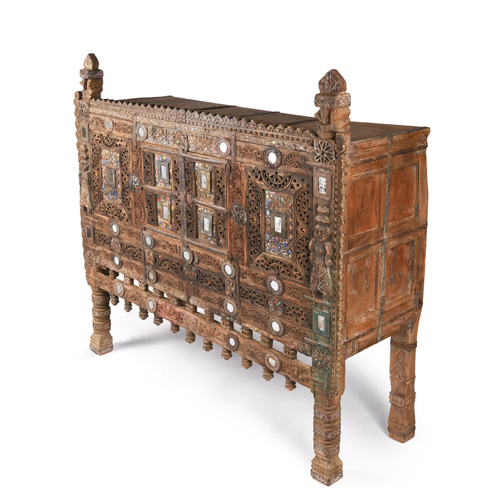 Detail from a carved Indian damchiya chests from The Rann of Kutch are classic examples of the furniture in the area. Their beautiful carving and mirror work is unique and they were used as dowry chests.