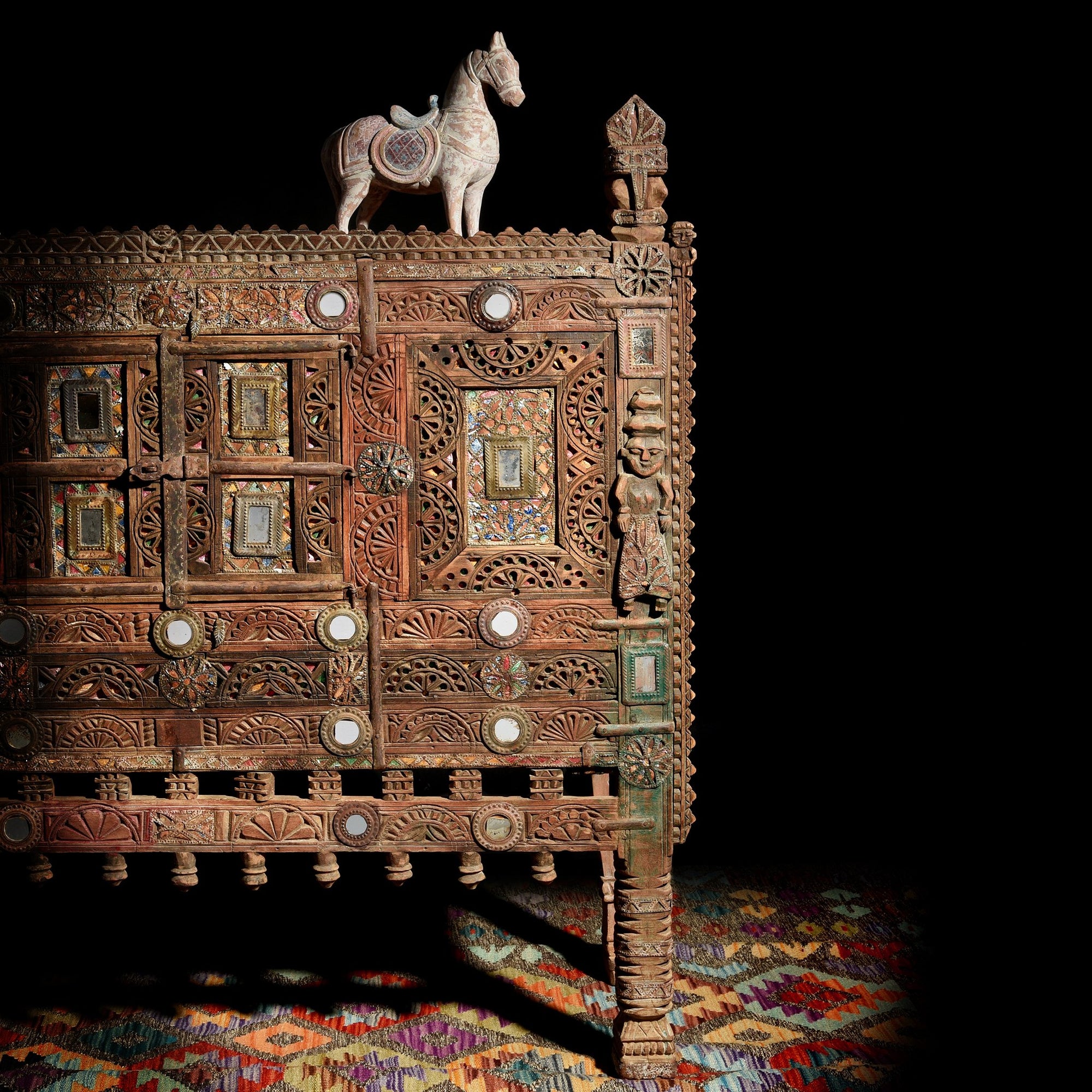 These carved Indian damchiya chests from The Rann of Kutch are classic examples of the furniture in the area. Their beautiful carving and mirror work is unique and they were used as dowry chests.