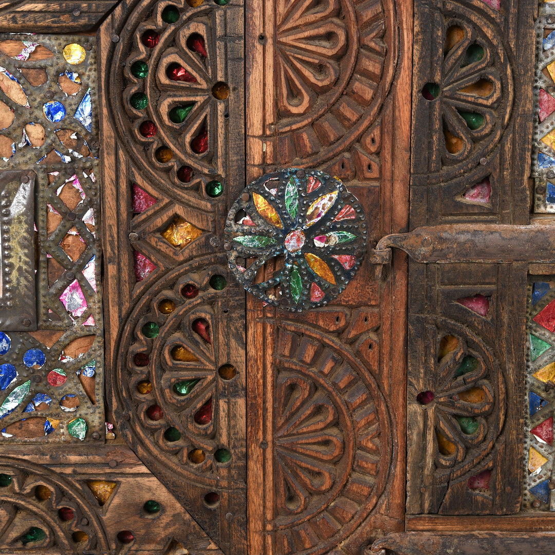 Detail from a carved Indian damchiya chests from The Rann of Kutch are classic examples of the furniture in the area. Their beautiful carving and mirror work is unique and they were used as dowry chests.