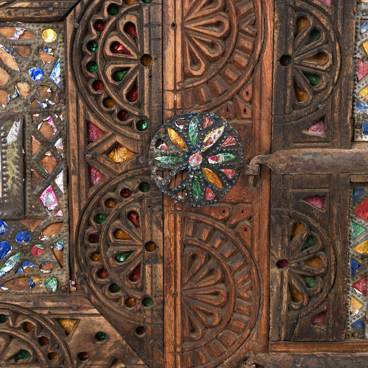 Detail from a carved Indian damchiya chests from The Rann of Kutch are classic examples of the furniture in the area. Their beautiful carving and mirror work is unique and they were used as dowry chests.