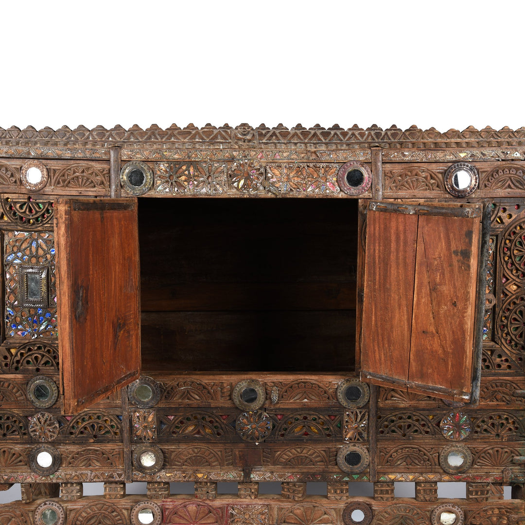 Detail from a carved Indian damchiya chests from The Rann of Kutch are classic examples of the furniture in the area. Their beautiful carving and mirror work is unique and they were used as dowry chests.