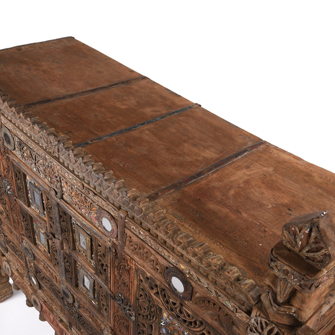 Detail from a carved Indian damchiya chests from The Rann of Kutch are classic examples of the furniture in the area. Their beautiful carving and mirror work is unique and they were used as dowry chests.