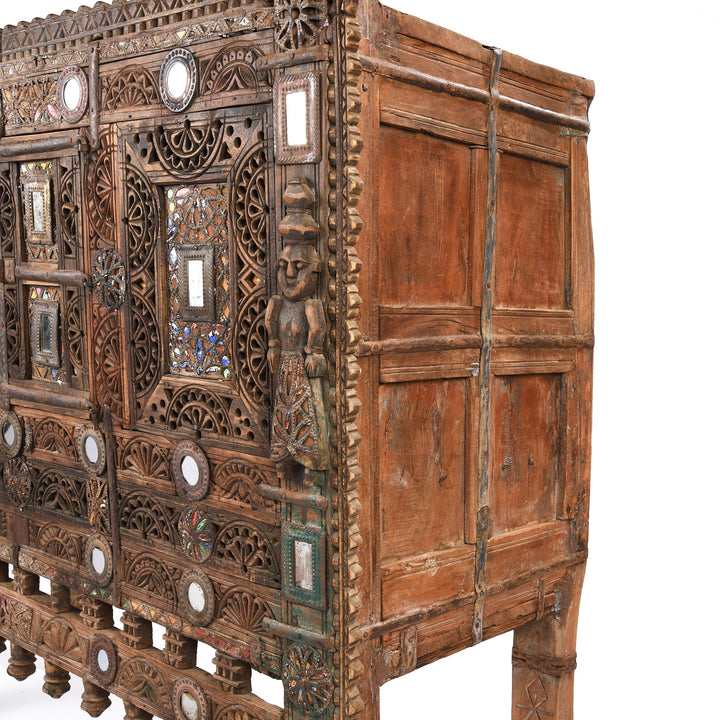 Detail from a carved Indian damchiya chests from The Rann of Kutch are classic examples of the furniture in the area. Their beautiful carving and mirror work is unique and they were used as dowry chests.